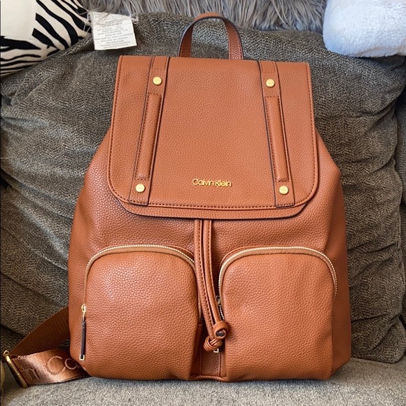 Calvin Klein Handbags - NWT Calvin Klein Brown leather bookbag/ backpack